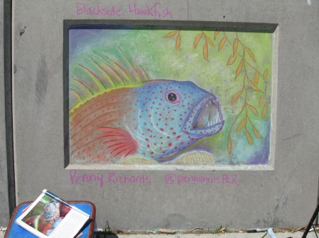 chalk image of a fish drawn on a wall